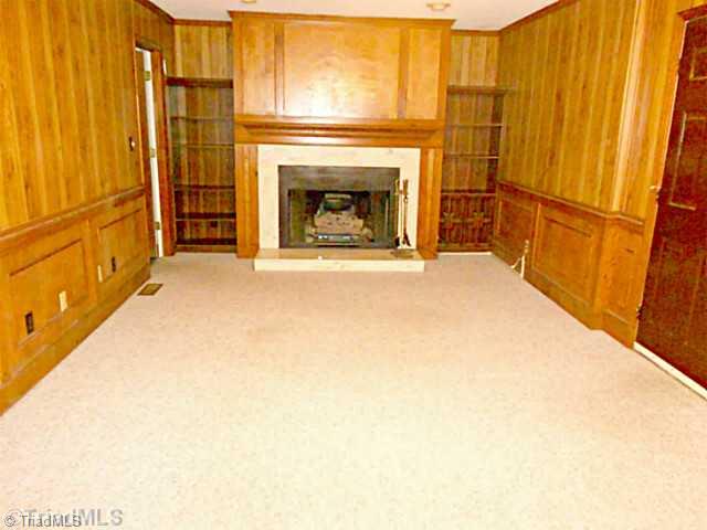 7905 Grey Fox Road Oak Ridge, NC 27310 - Photo 4 of 16 Den/Family/Great Room. Den with beautiful fireplace