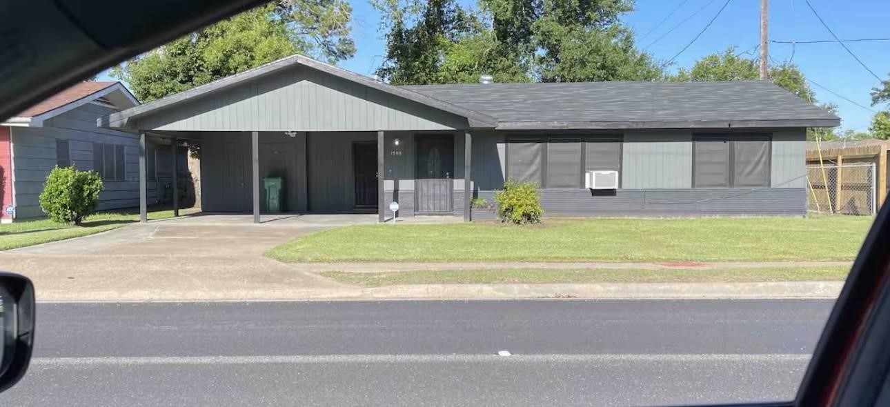 a swimming pool with a table and chairs under an umbrella