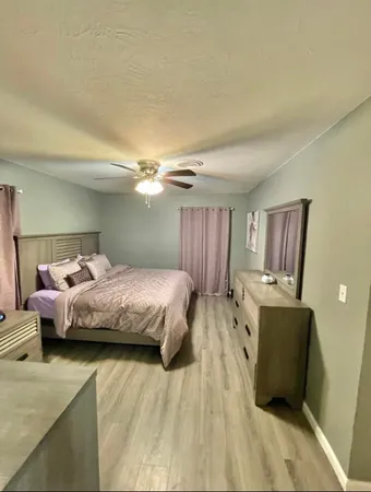 a bedroom with a bed and furniture