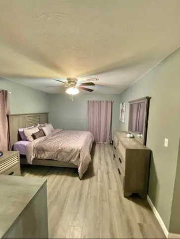 a bedroom with a bed and furniture