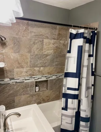a bathroom with a sink and mirror
