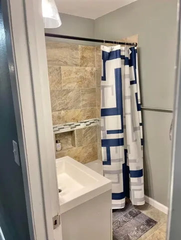 a bathroom with a sink and mirror