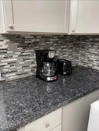 a close view of a stove a microwave and cabinets