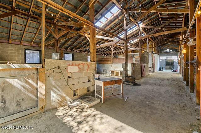 115 La Quinta Place St. Augustine, FL 32084 - Photo 18 of 32 a view of a patio with table and chairs with wooden floor