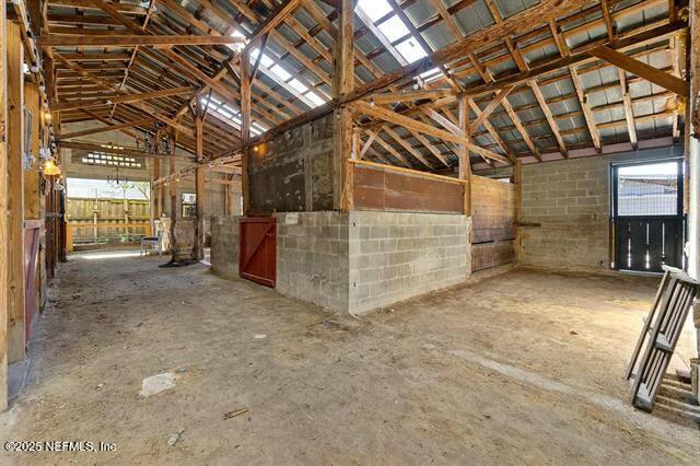 115 La Quinta Place St. Augustine, FL 32084 - Photo 19 of 32 a view of empty room with wooden walls