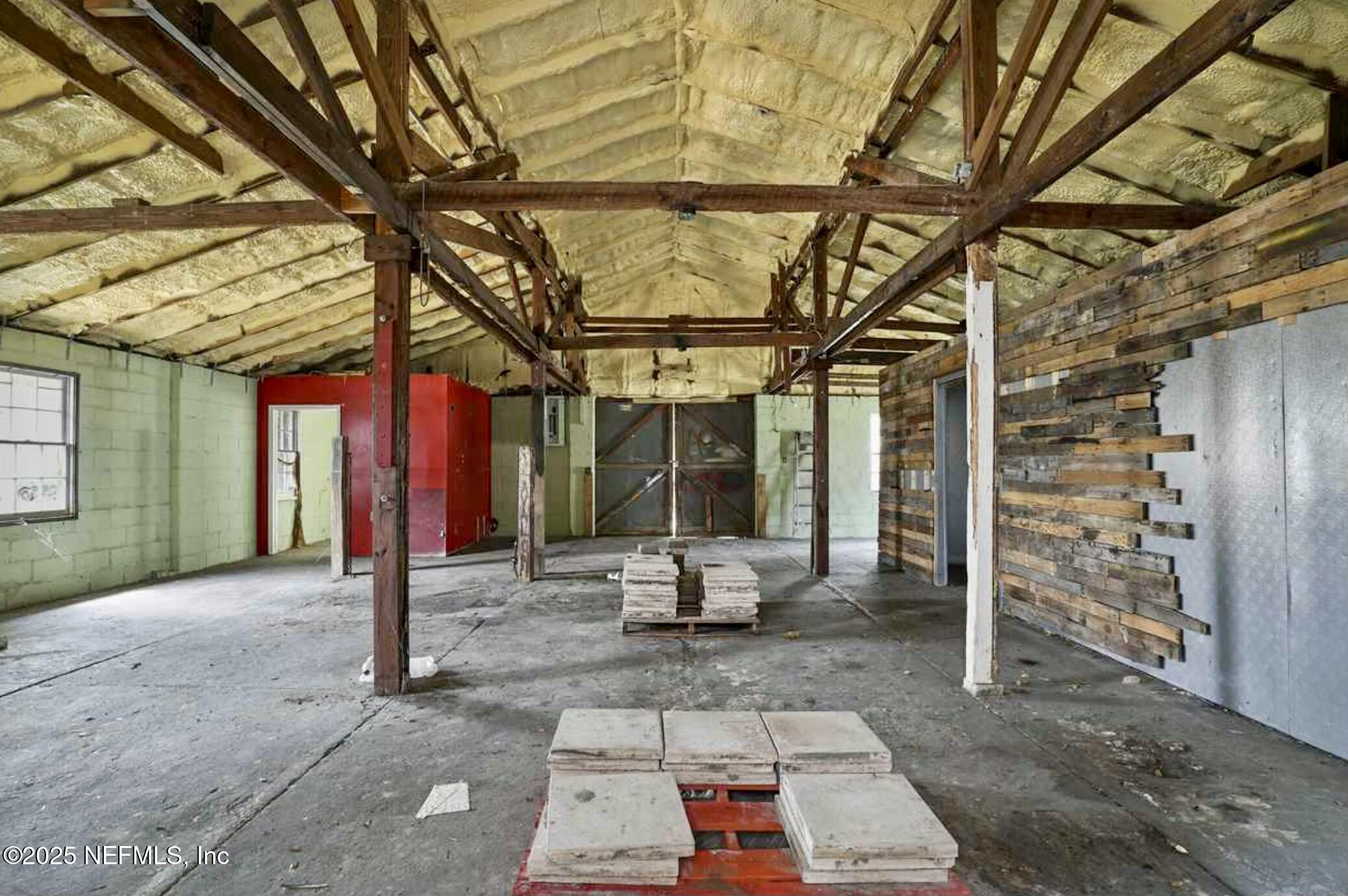115 La Quinta Place St. Augustine, FL 32084 - Photo 26 of 32 a view of a patio with table and chairs and potted plants