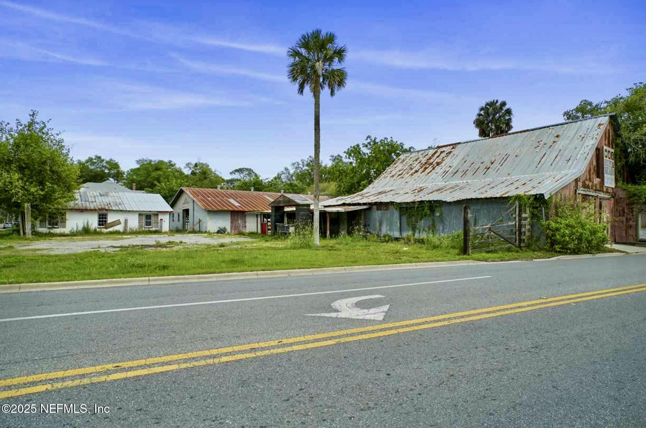 115 La Quinta Place St. Augustine, FL 32084 - Photo 3 of 32 a view of a house with a swimming pool and a yard