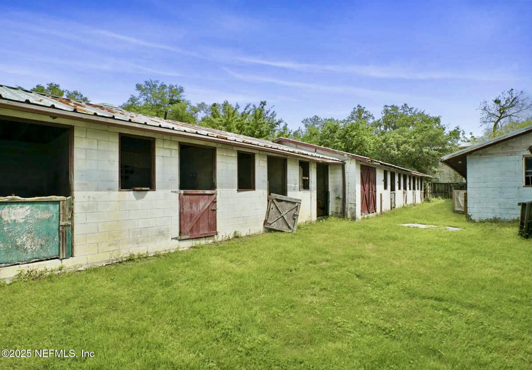115 La Quinta Place St. Augustine, FL 32084 - Photo 9 of 32 a front view of a house with a garden