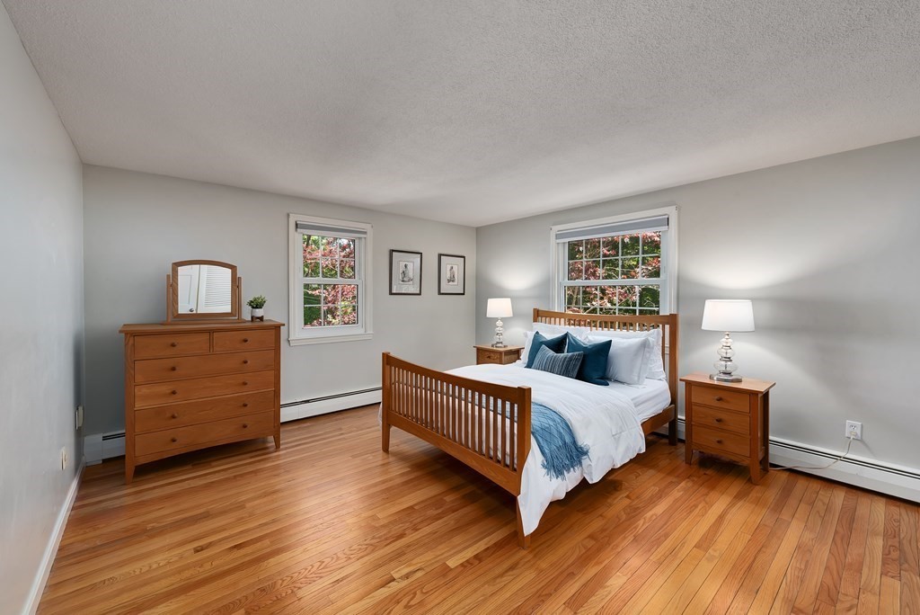 2 Pye Brook Lane Boxford, MA 01921 - Photo 11 of 30 a bedroom with a bed and wooden floor