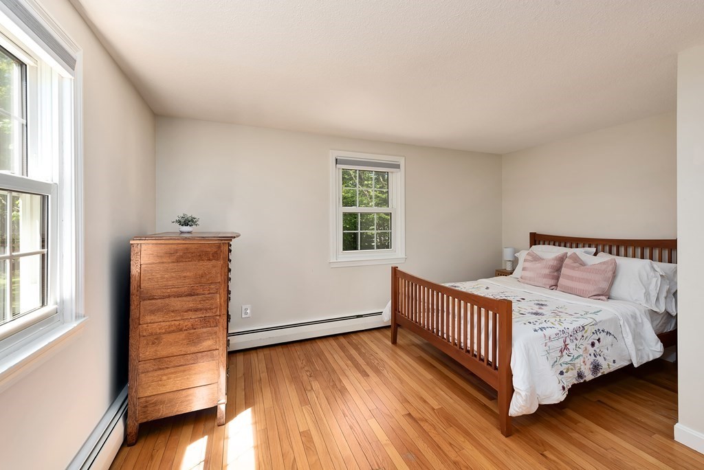 2 Pye Brook Lane Boxford, MA 01921 - Photo 12 of 30 a bedroom with a bed and wooden floor