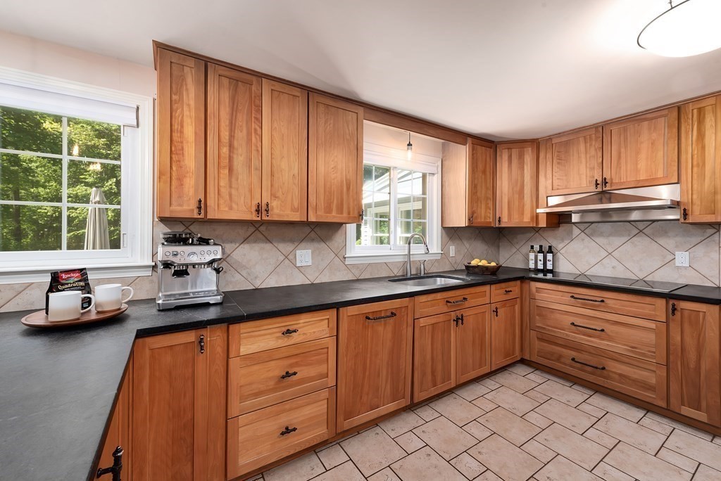 2 Pye Brook Lane Boxford, MA 01921 - Photo 3 of 30 a kitchen with granite countertop wooden cabinets a sink a stove a window and stainless steel appliances