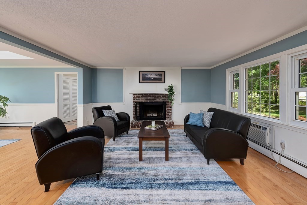 2 Pye Brook Lane Boxford, MA 01921 - Photo 6 of 30 a living room with furniture and a fireplace