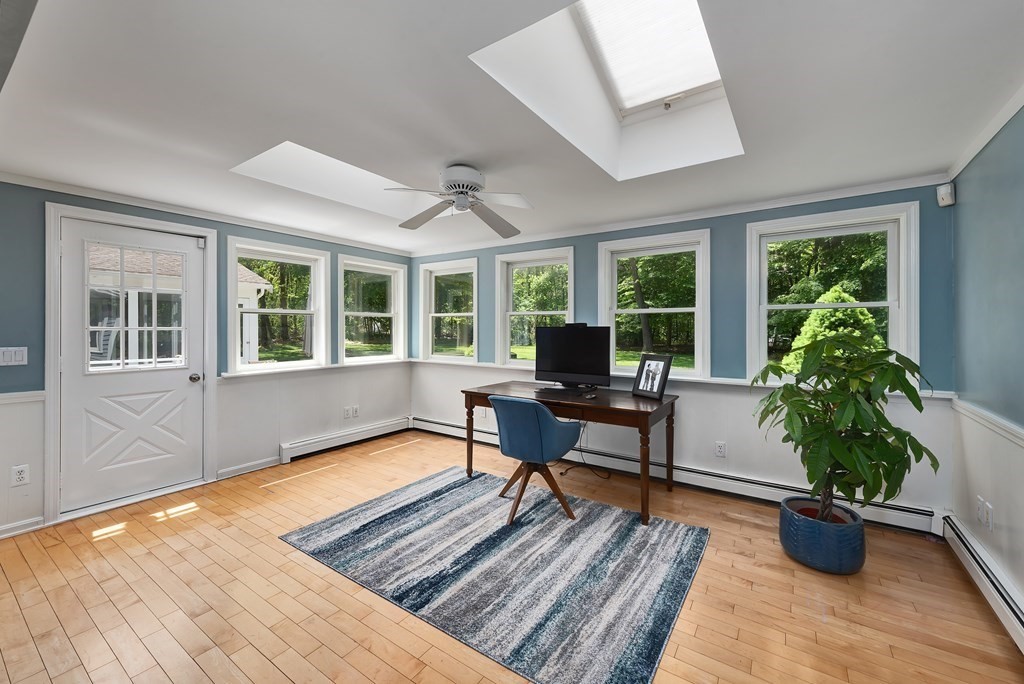 2 Pye Brook Lane Boxford, MA 01921 - Photo 7 of 30 a living room with furniture potted plant floor to ceiling windows and a potted plant