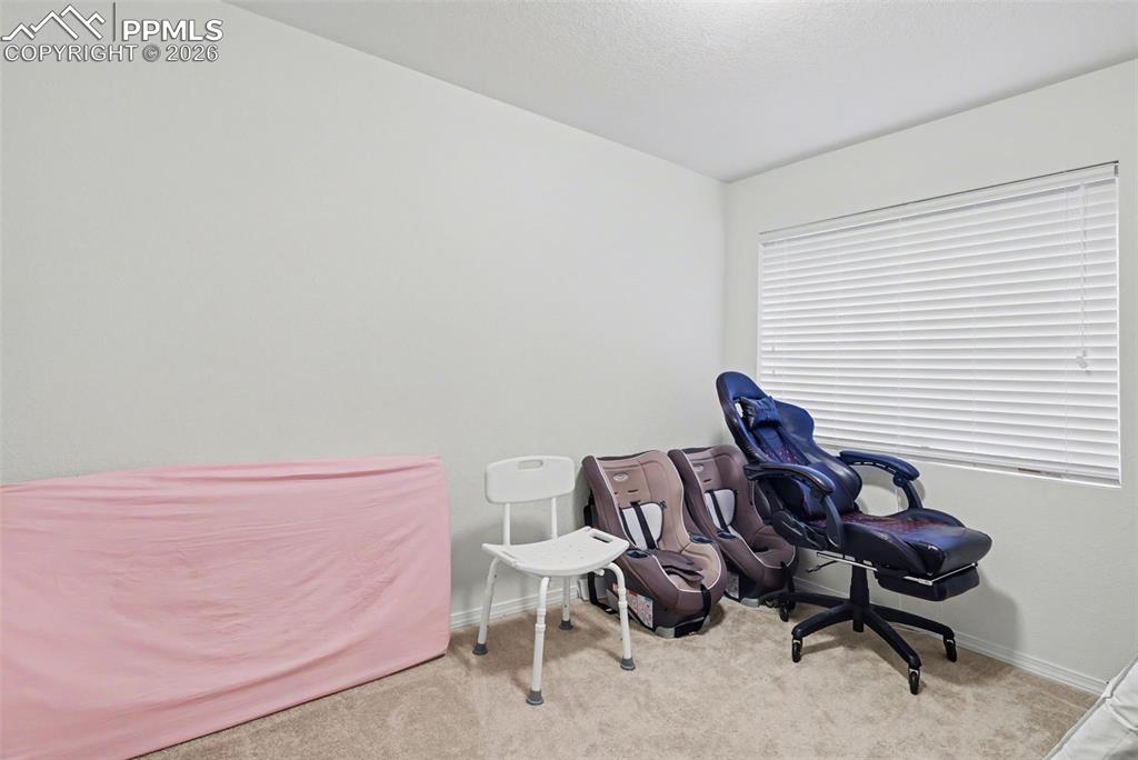 2579 Malpaso Point Colorado Springs, CO 80922 - Photo 13 of 15 a view of a workspace with furniture