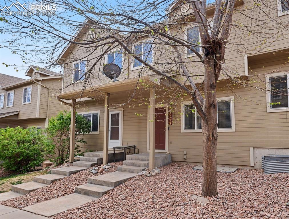 2579 Malpaso Point Colorado Springs, CO 80922 - Photo 15 of 15 a view of a house with a yard