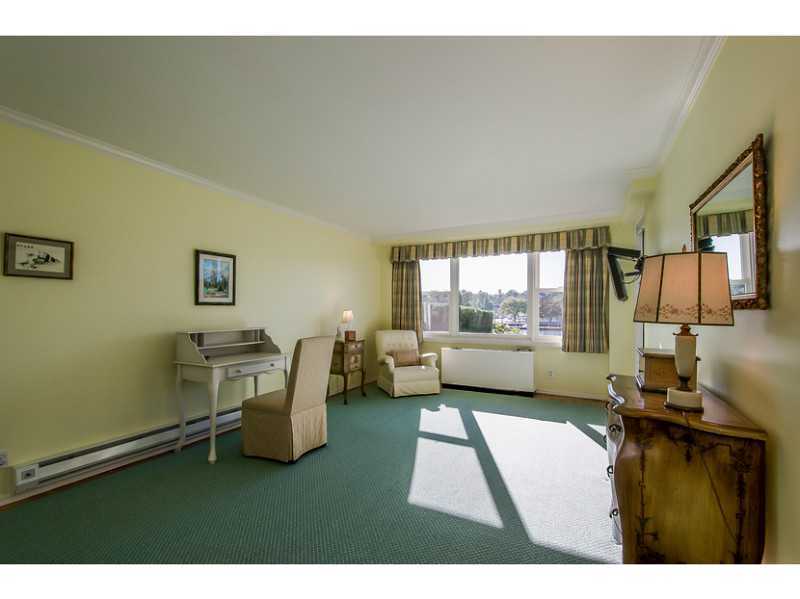 630 Steamboat Road, Unit 1A Greenwich, CT 06830 - Photo 13 of 24 a living room with furniture and a flat screen tv