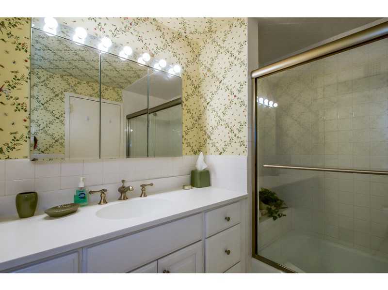 630 Steamboat Road, Unit 1A Greenwich, CT 06830 - Photo 15 of 24 a bathroom with a sink and a mirror