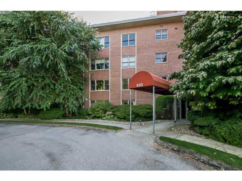 630 Steamboat Road, Unit 1A Greenwich, CT 06830 - Photo 18 of 24 a view of a house next to a yard