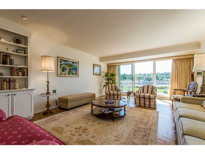 630 Steamboat Road, Unit 1A Greenwich, CT 06830 - Photo 5 of 24 a living room with furniture and a floor to ceiling window