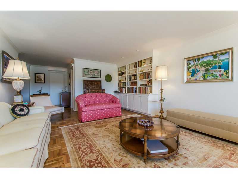 630 Steamboat Road, Unit 1A Greenwich, CT 06830 - Photo 6 of 24 a living room with furniture and a flat screen tv
