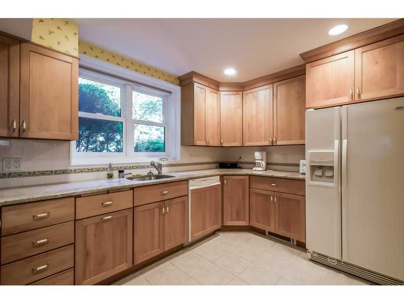 630 Steamboat Road, Unit 1A Greenwich, CT 06830 - Photo 10 of 24 a kitchen with granite countertop appliances cabinets and a sink