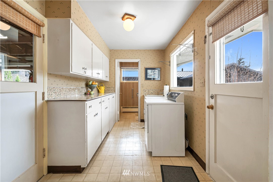 426 Bayside Road Bellingham, WA 98225 - Photo 18 of 40 a kitchen with a refrigerator a stove top oven and a window