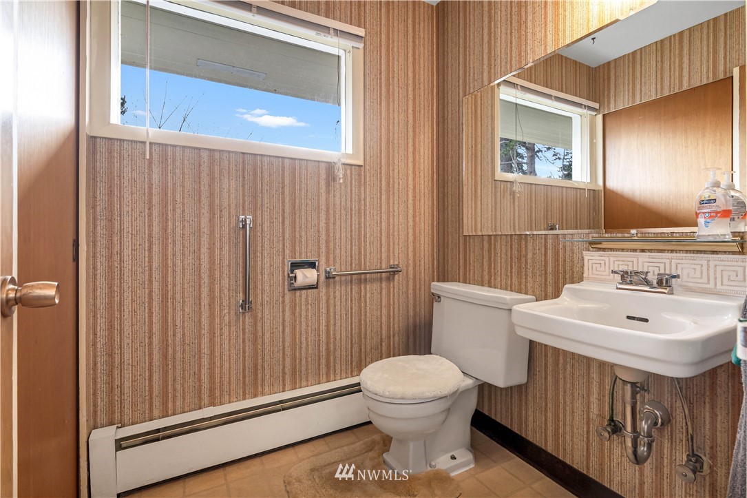 426 Bayside Road Bellingham, WA 98225 - Photo 19 of 40 a bathroom with a sink a toilet and shower