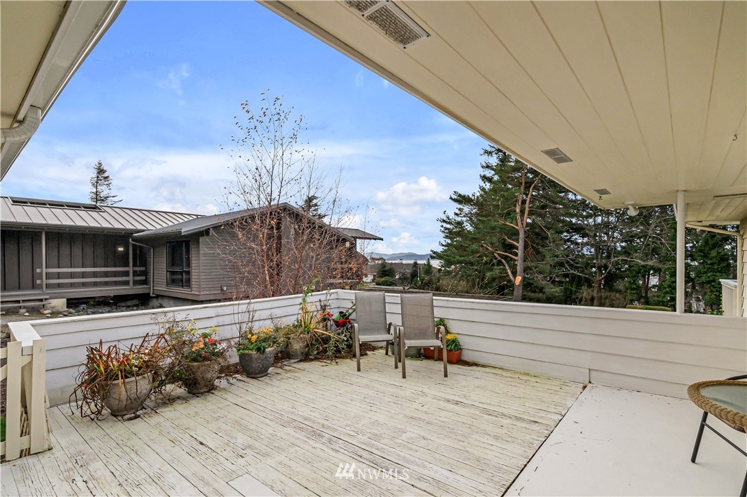 426 Bayside Road Bellingham, WA 98225 - Photo 20 of 40 a room with lots of trees and furniture