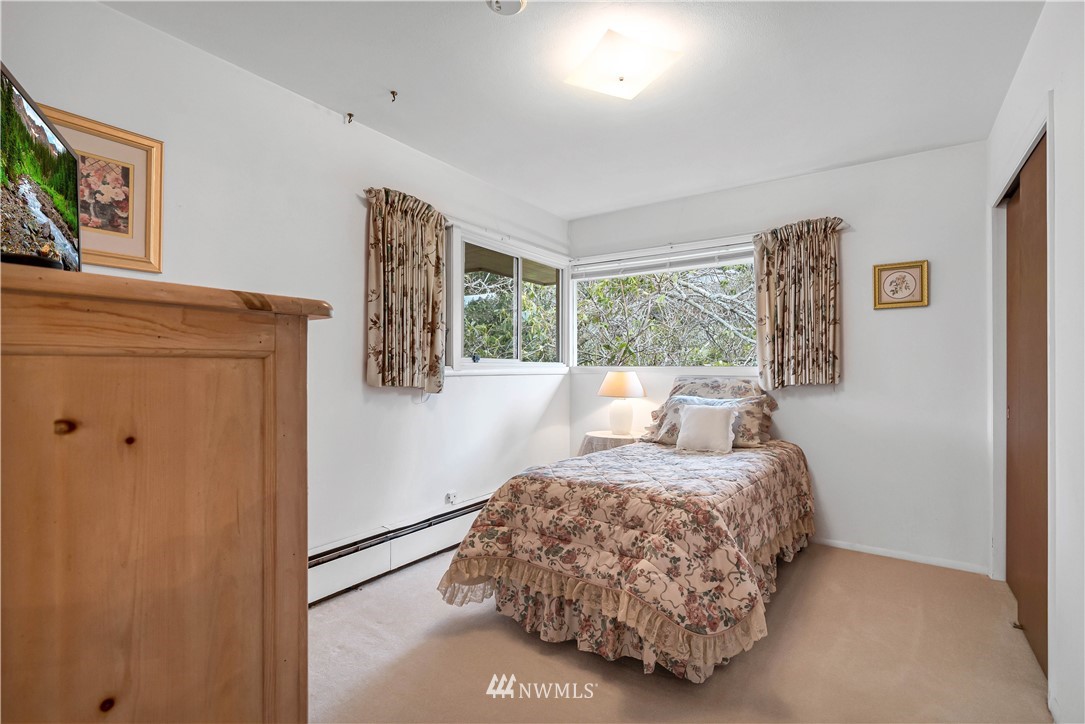 426 Bayside Road Bellingham, WA 98225 - Photo 23 of 40 a bedroom with a bed and a window