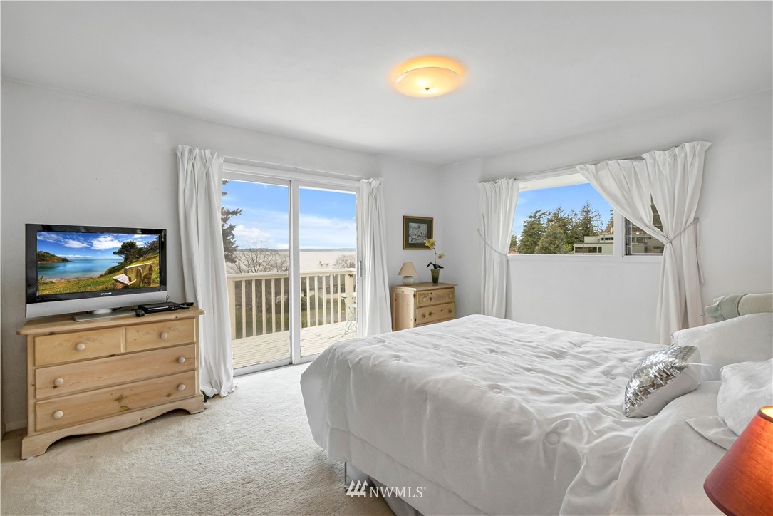 426 Bayside Road Bellingham, WA 98225 - Photo 25 of 40 a bedroom with a bed and a flat screen tv
