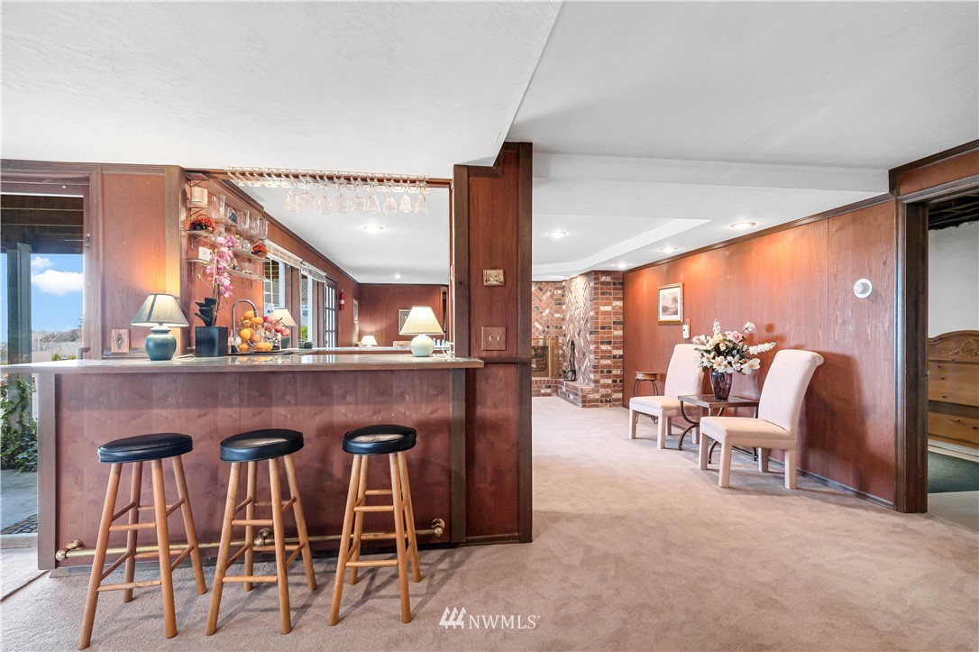 426 Bayside Road Bellingham, WA 98225 - Photo 30 of 40 a living room with furniture a large window and kitchen view