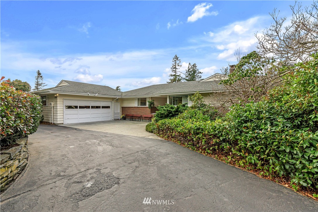 426 Bayside Road Bellingham, WA 98225 - Photo 5 of 40 a view of a house with a yard and potted plants