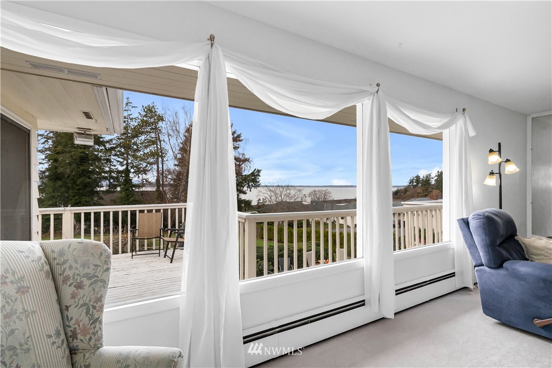 426 Bayside Road Bellingham, WA 98225 - Photo 7 of 40 a balcony view with a large window and outdoor view