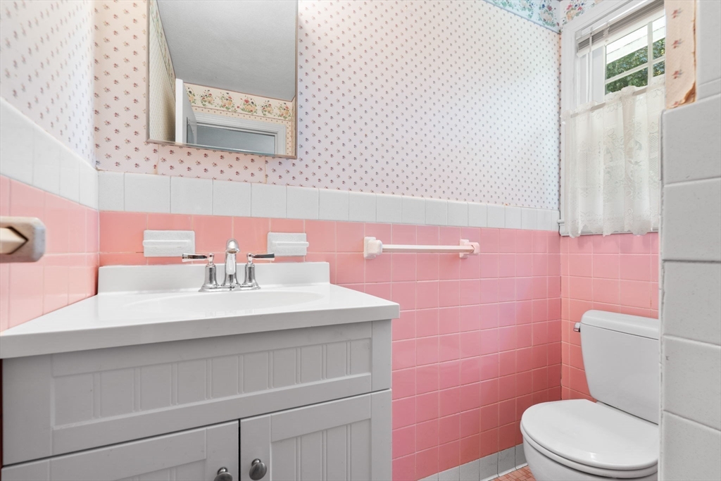 348 Belknap Road Framingham, MA 01701 - Photo 16 of 35 a bathroom with a sink a toilet and a mirror