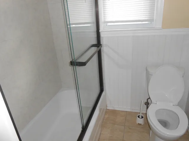 a bathroom with a toilet and a sink