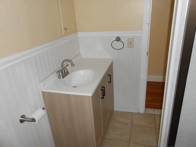 a bathroom with a sink and mirror