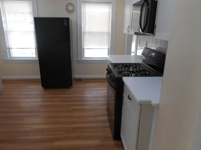 a kitchen with a sink and a refrigerator