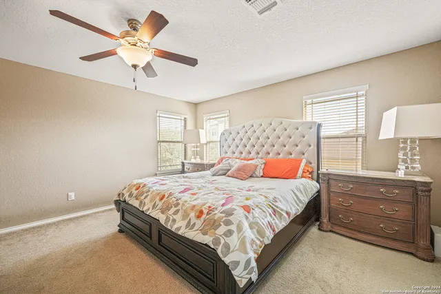 a bedroom with a bed and a cabinets