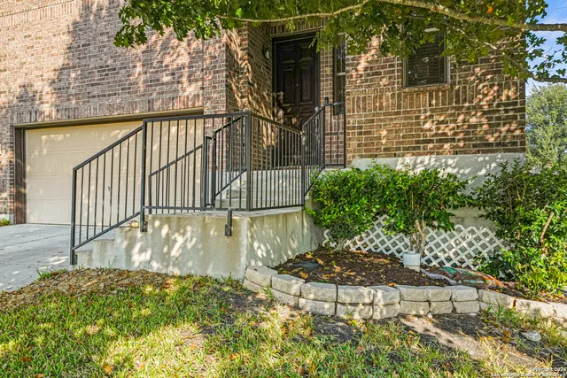 a view of a brick house with a large door