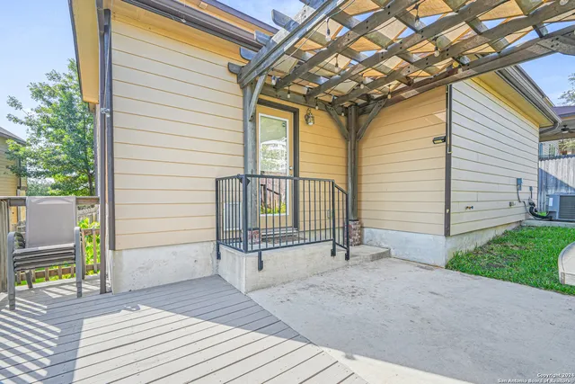 a view of a house with a yard patio and a garden