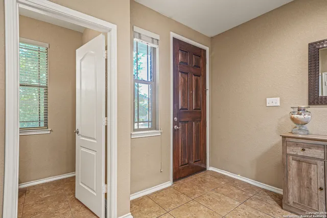 a bathroom with a sink toilet and a mirror