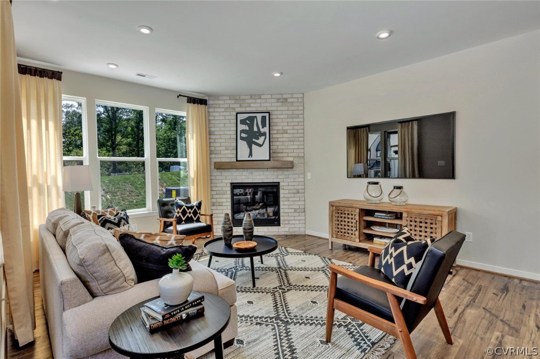 a living room with furniture fireplace and a flat screen tv