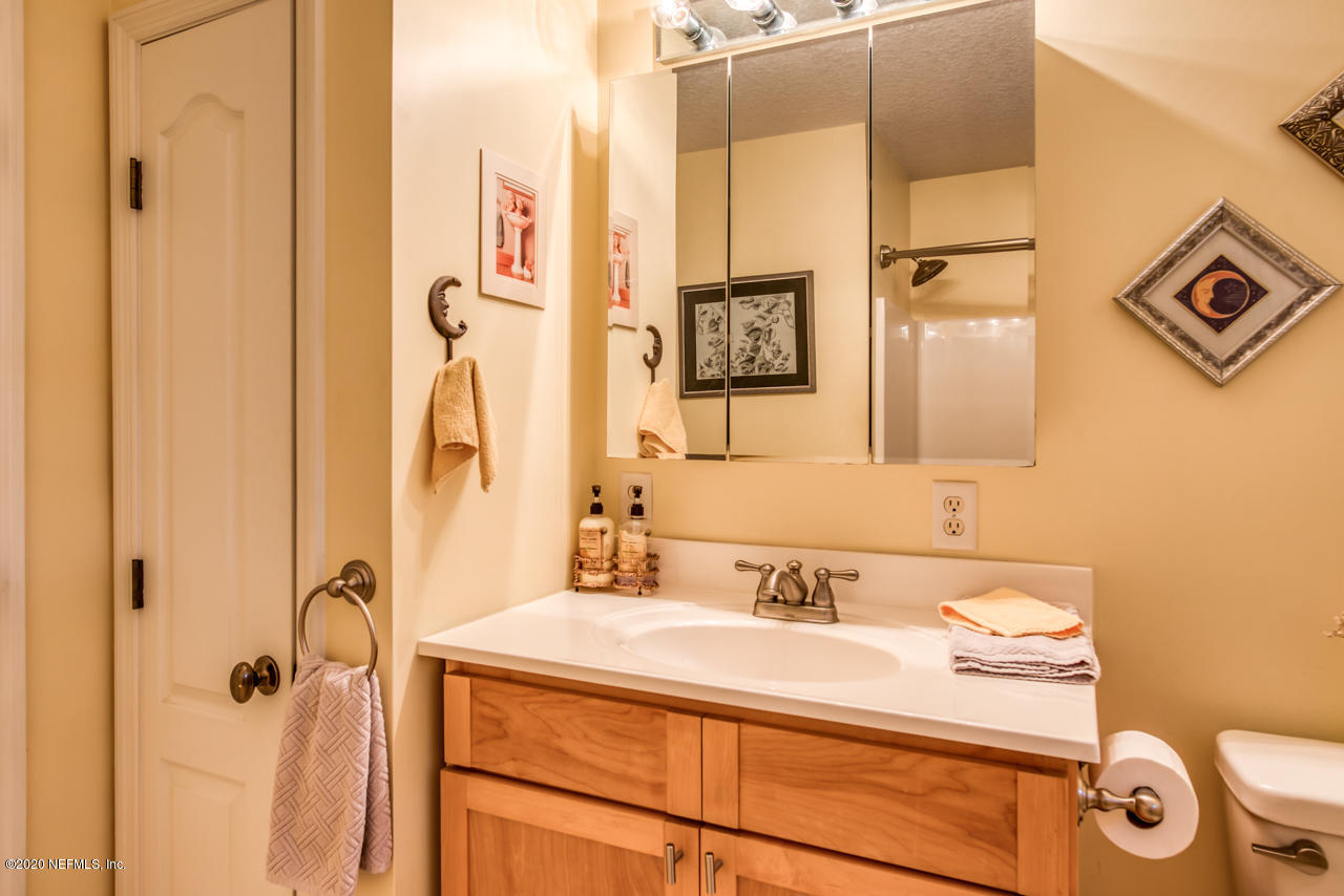 7020 Catlett Road St. Augustine, FL 32095 - Photo 28 of 50 a bathroom with a sink and a mirror