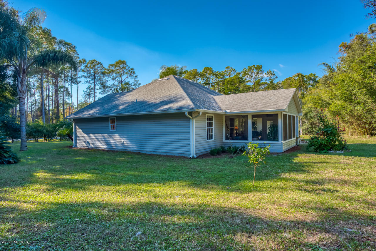 7020 Catlett Road St. Augustine, FL 32095 - Photo 48 of 50 a front view of a house with a yard