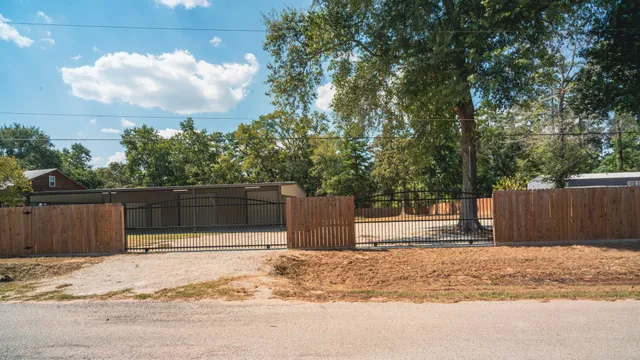 a house view with wooden fence