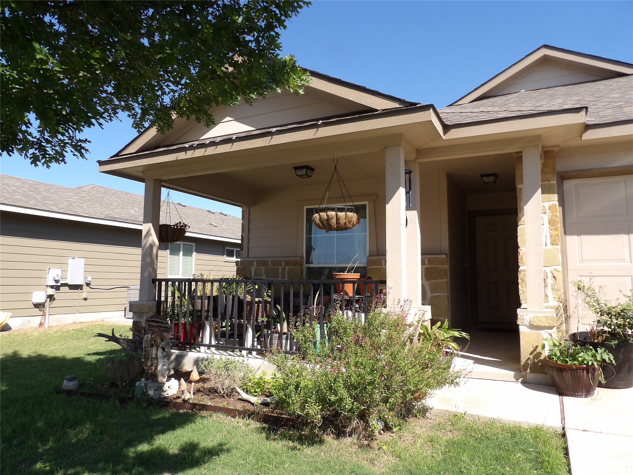 930 Pumpkin Ridge New Braunfels, TX 78130 - Photo 32 of 32 Covered front porch with stone accents and a metal railing. Your plants will love this porch!