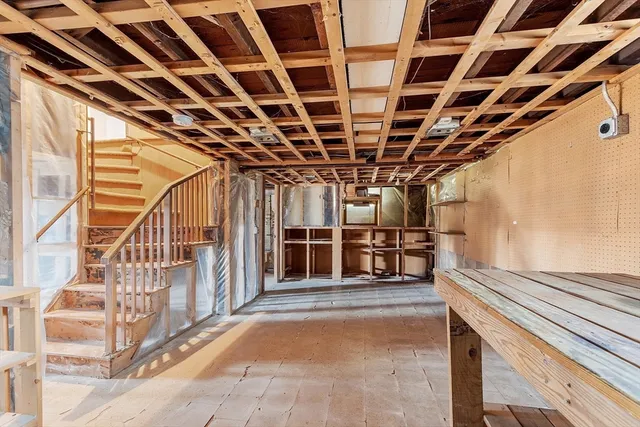 a view of an empty room with stairs