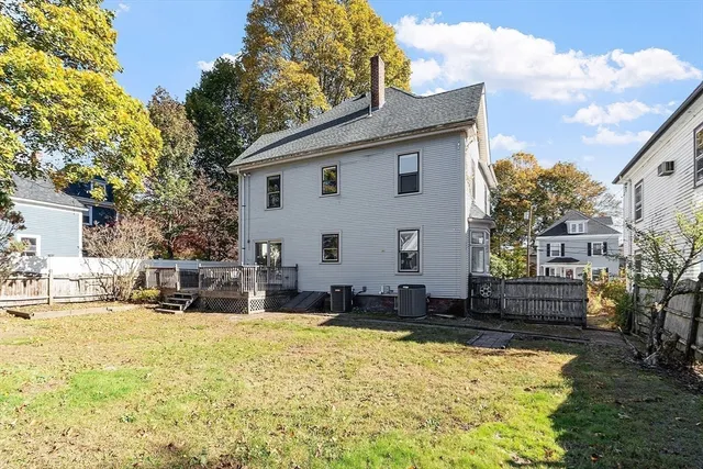 a view of a house with swimming pool and sitting area