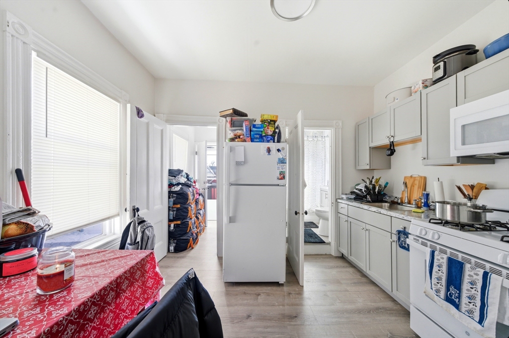 14-16 Ripley Street Malden, MA 02148 - Photo 32 of 37 a kitchen with a refrigerator and a sink