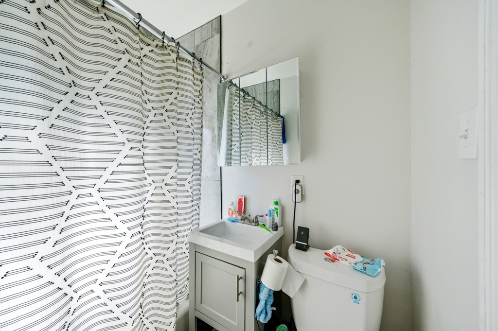 14-16 Ripley Street Malden, MA 02148 - Photo 33 of 37 a utility room with dryer and washer